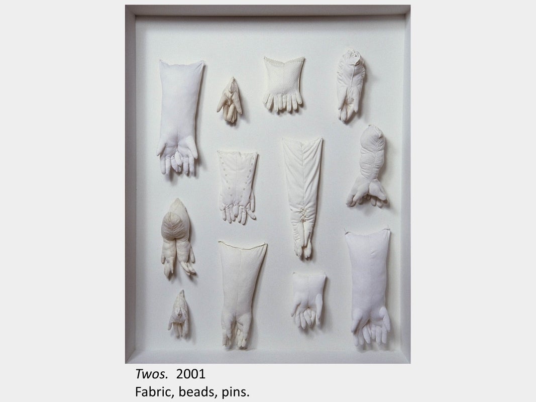 Artwork by Sheila McMath. Twos. 2001. Fabric, beads, pins.