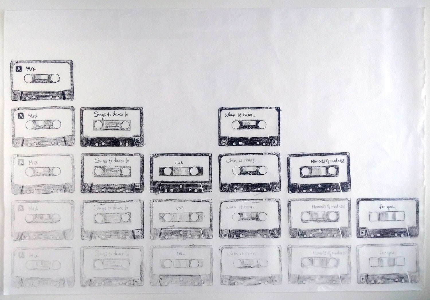 Black and white prints of various audio cassette tapes fill the bottom half of the page.