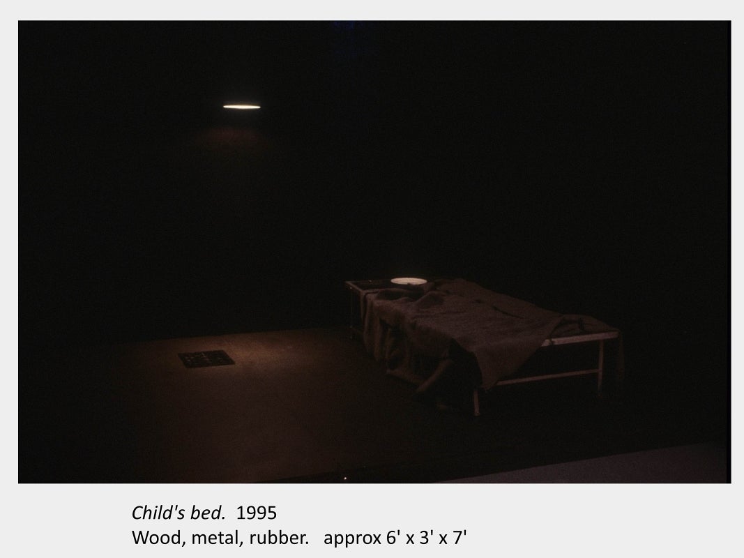Artwork by Judith Mullett. Child's bed. 1995. Wood, metal, rubber. approx 6' x 3' x 7'