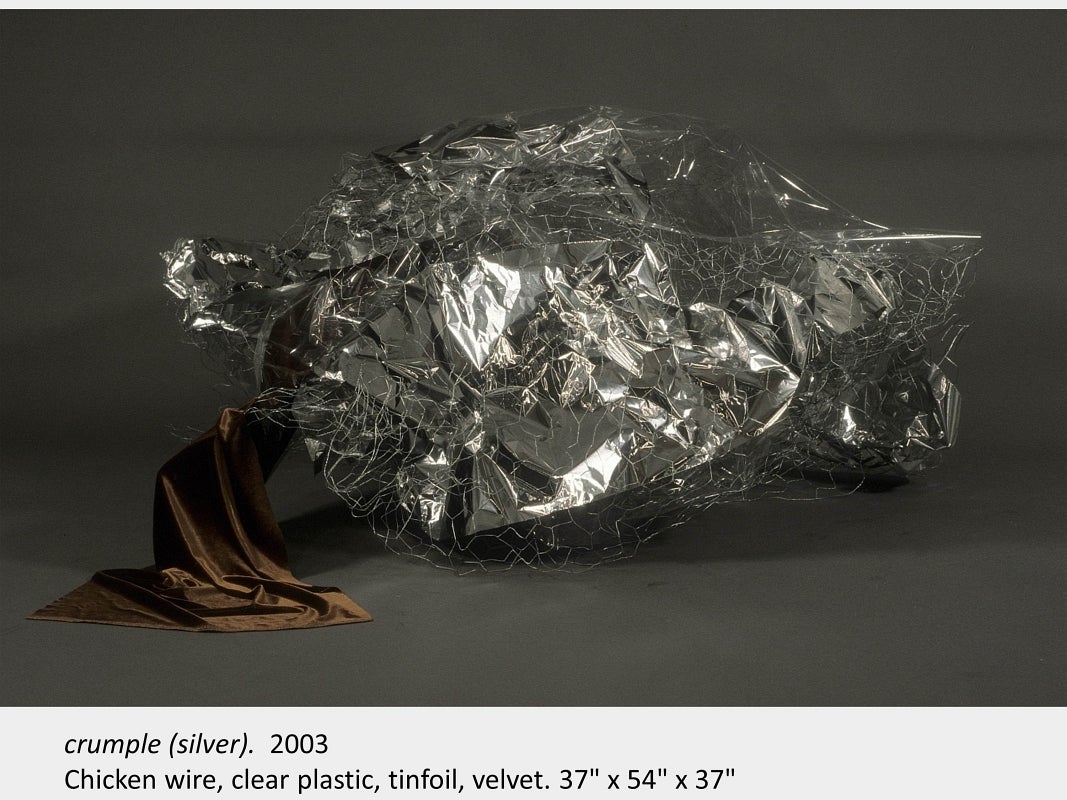 Artwork by Michael Murphy. crumple (silver). 2003. Chicken wire, clear plastic, tinfoil, velvet. 37" x 54" x 37"