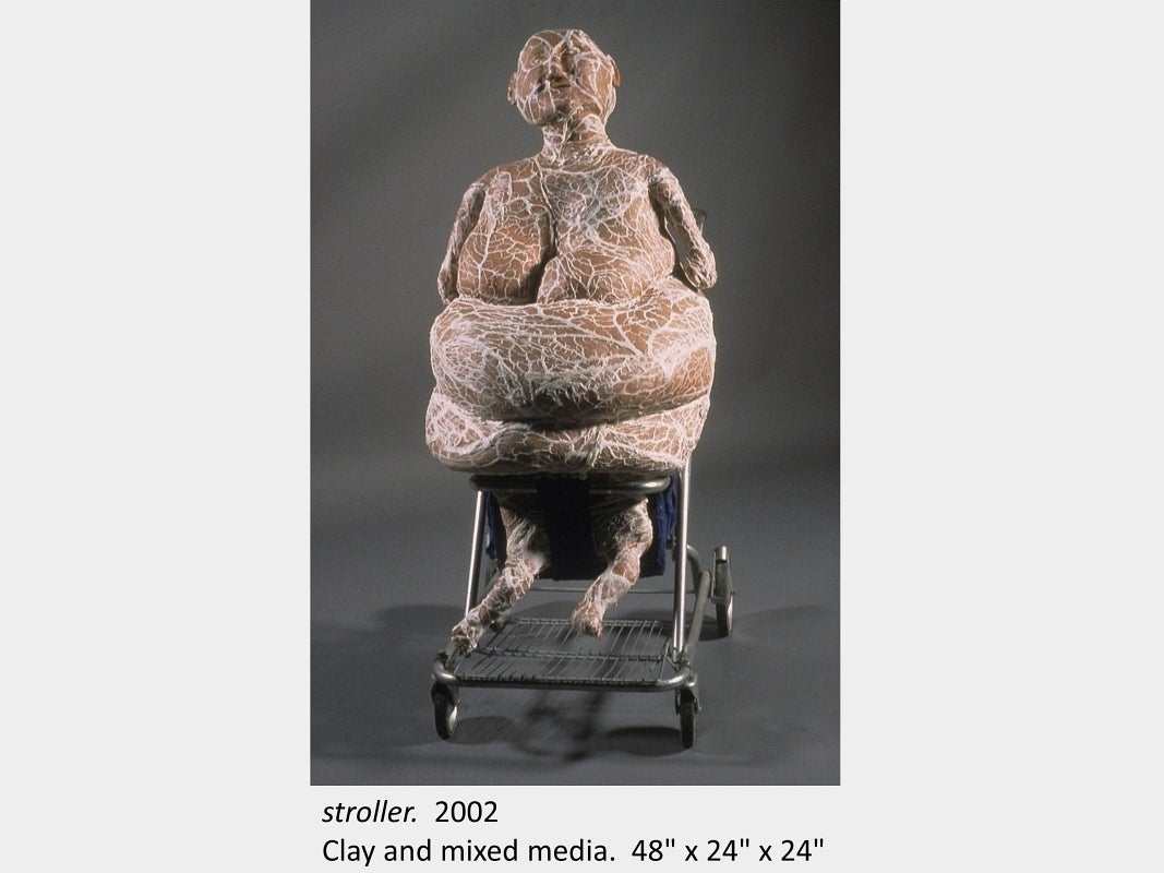 Artwork by Kasia Piech. stroller. 2002. Clay and mixed media. 48" x 24" x 24"