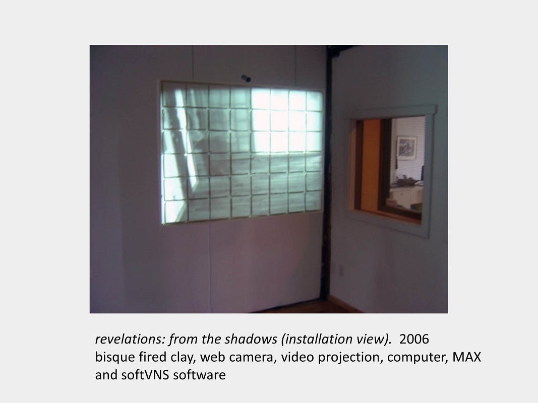Artwork by Daria Magas-Zamaria. revelations: from the shadows (installation view). 2006. bisque fired clay, video projection