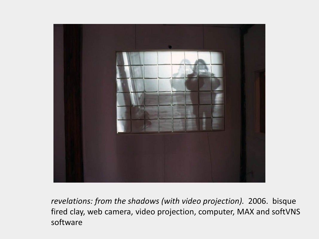Artwork by Daria Magas-Zamaria. revelations: from the shadows (with video projection). 2006. bisque fired clay, video projection