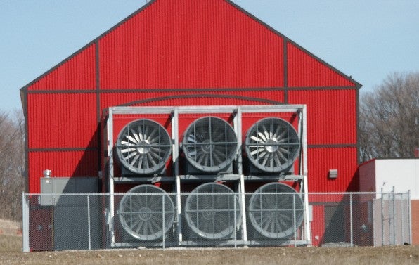 Six wind generation fans at the back of the Facility building
