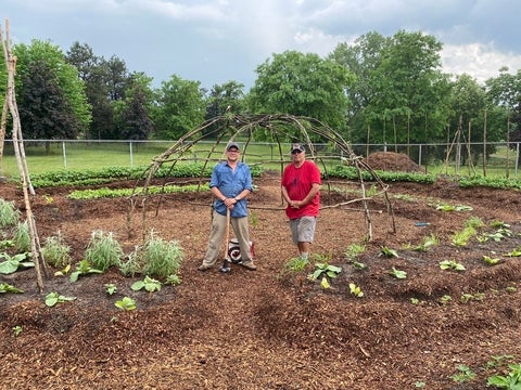 Clarence Cachagee and Myeengun Henry at Conestoga College Indigenous Studies Garden