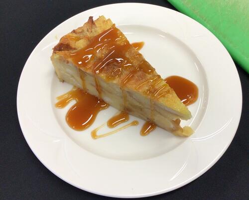bread pudding with caramel drizzled on top