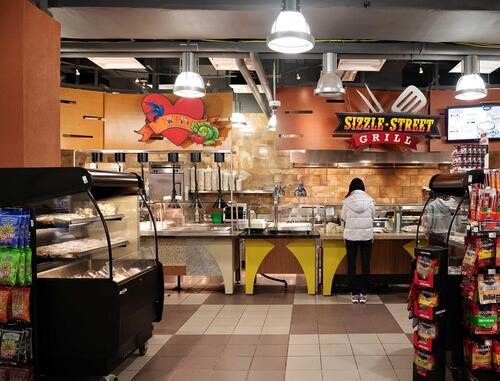 Sizzle Street Grill and Mom's Counter stations inside of Mudies at V1