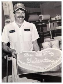 Paul Gatcke pictured holding a cake in 1989.