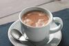Hot chocolate in a mug with a spoon