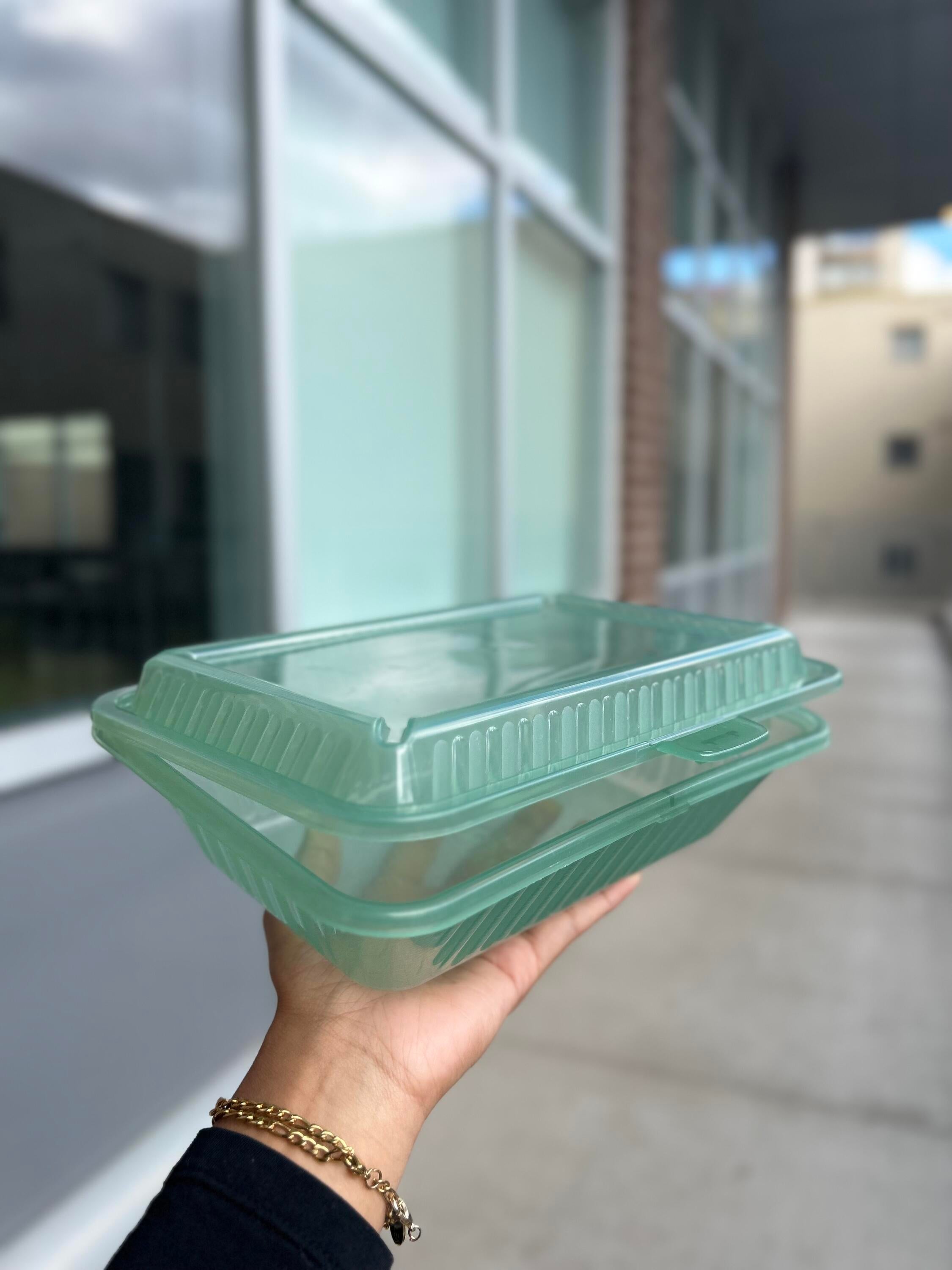 Student holding an eco-container 