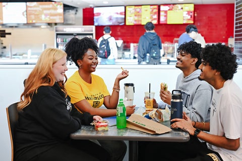 Students eating together in the Student Life Centre