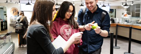 Dietitian assisting two students