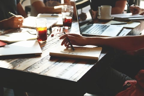 People sitting at a desk working