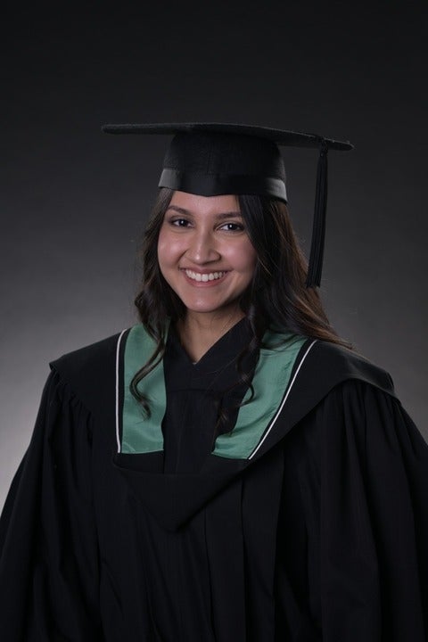Anuja Binning in graduation cap and gown