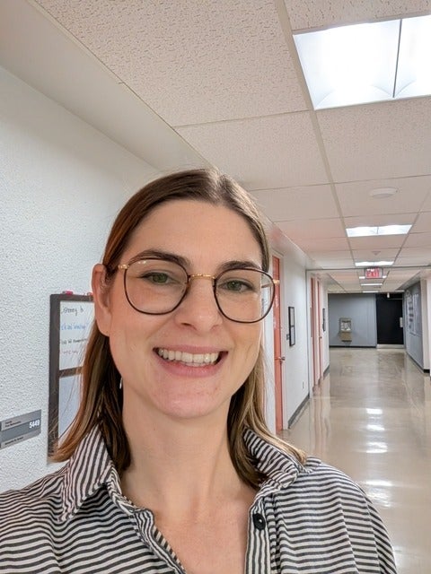Samantha St. Amand in a hallway