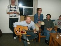 Students playing guitar and singing