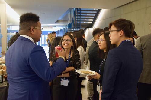 Fusion confrence 2019 attendees talking and eating