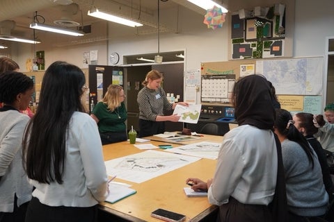 People standing around a table