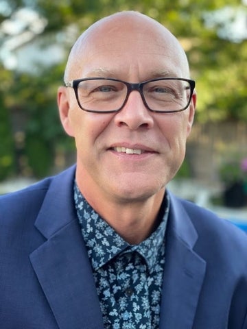 A portrait photograph of Clarence Woudsma