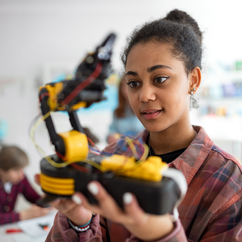 A student with a robot project