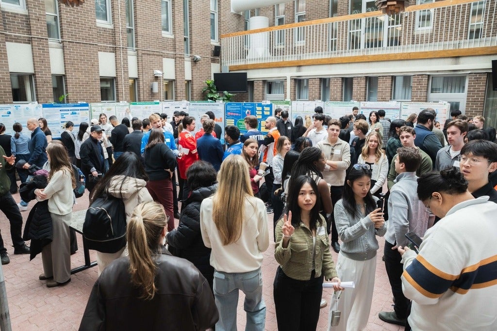 Students fill the space at the Capstone Symposium