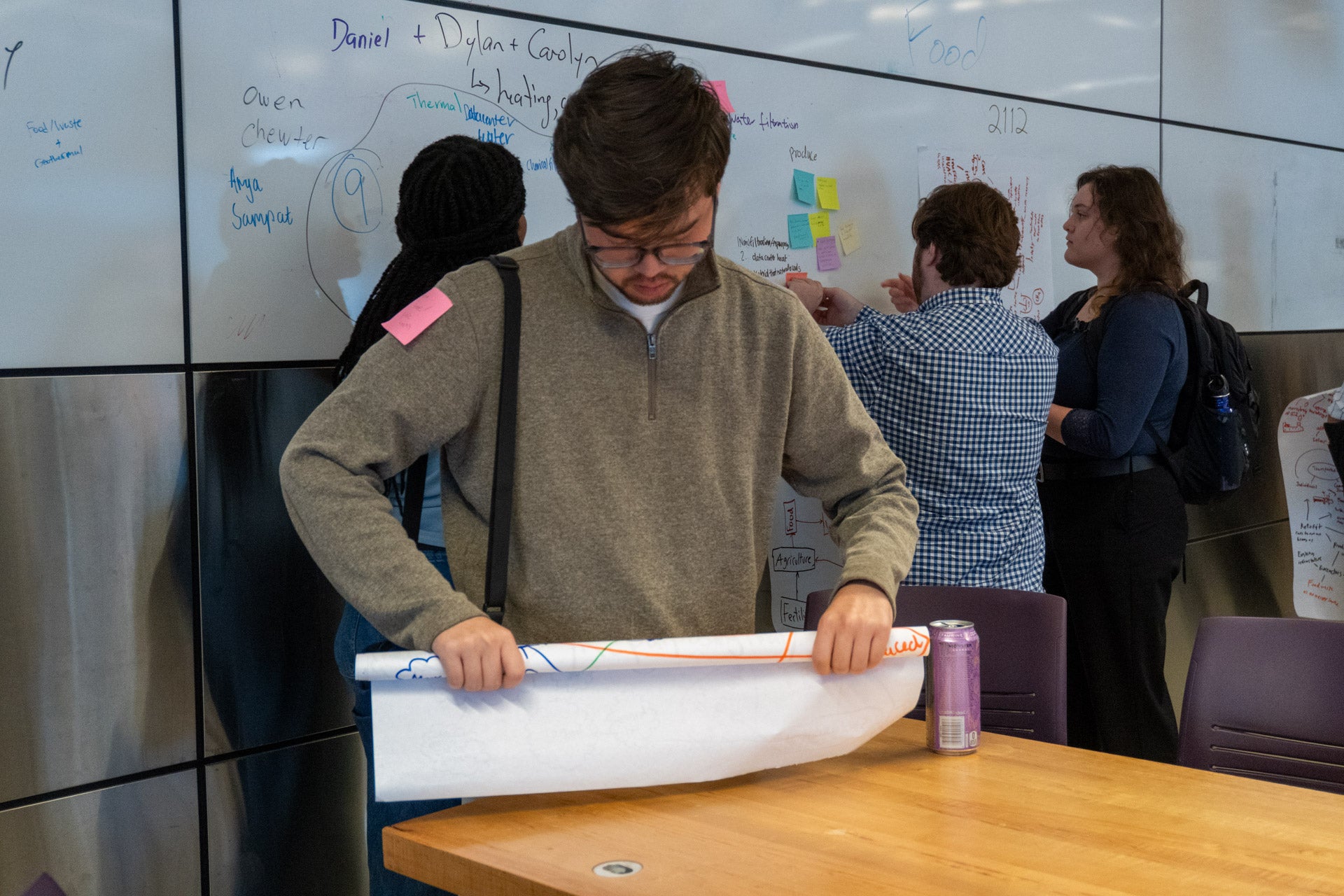 a student has stuck a sticky note on a fellow presenter