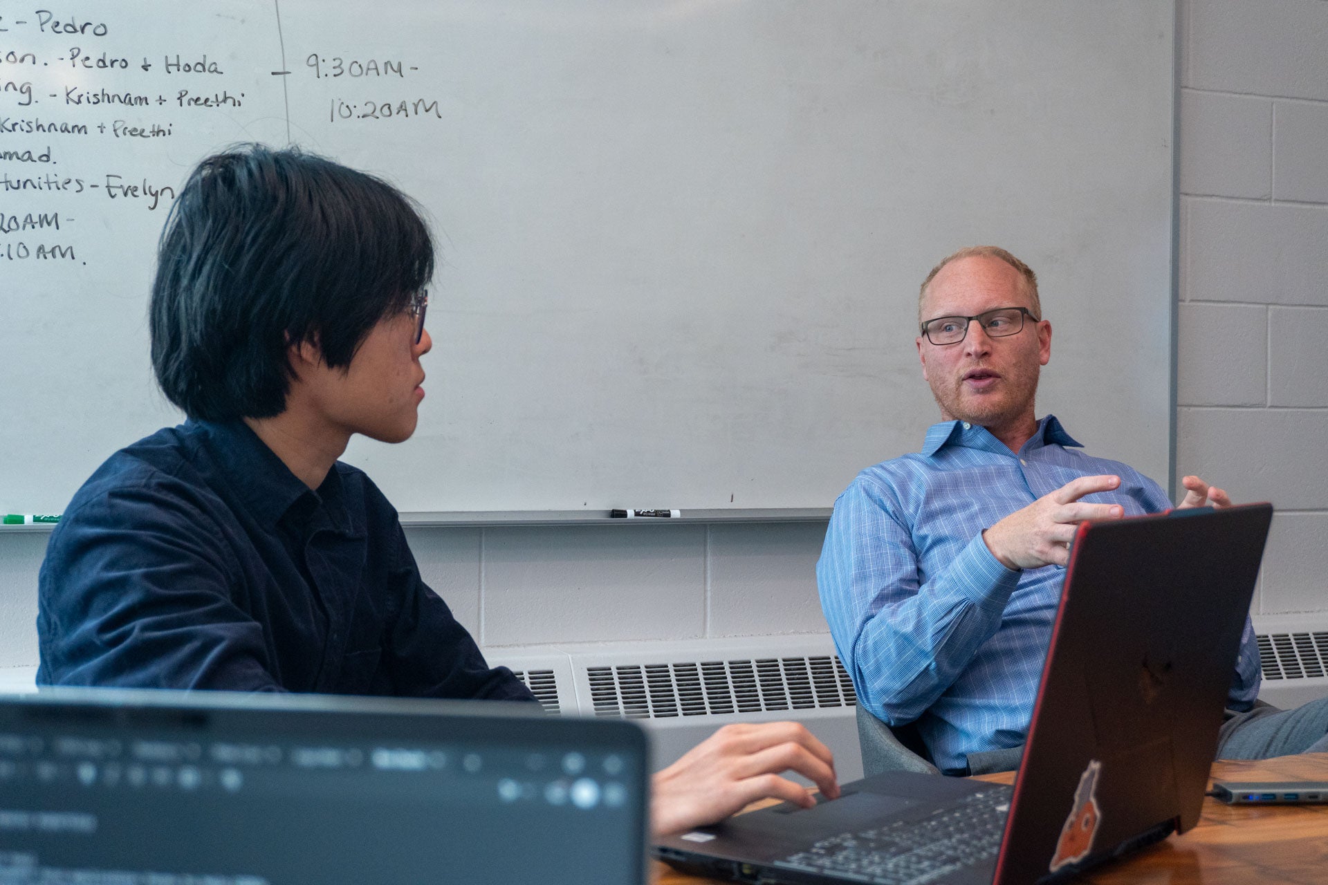 Ben Dachis giving feedback to co-op student Tony Lin
