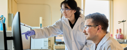 Science students working together in a lab.