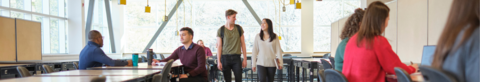 Students studying and walking through the Planning Studio in the Environment 3 building.