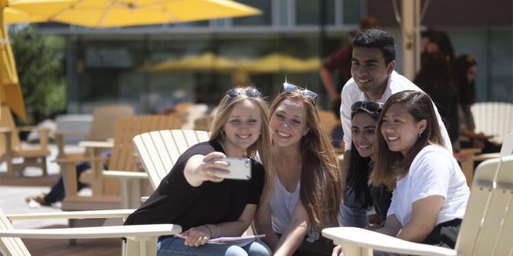 Students taking a group selfie.