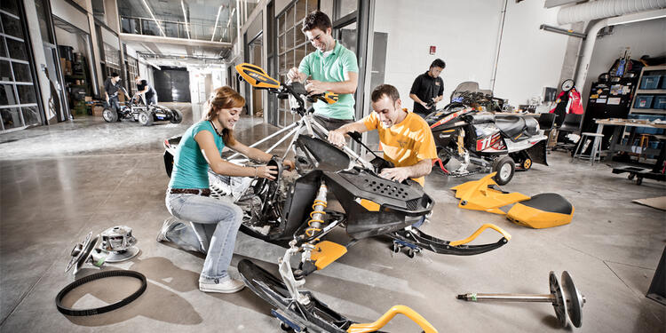 Students building a vehicle in the student design centre.