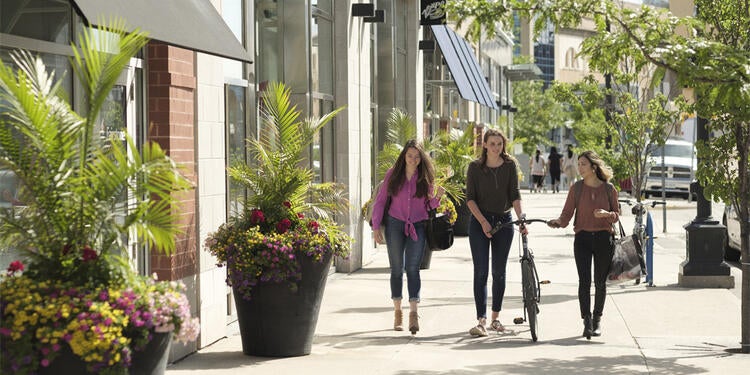 Students walking down a street in the city of Waterloo.