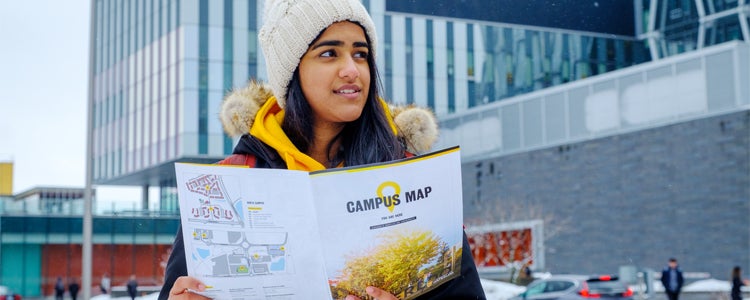 A student taking a campus tour at the University of Waterloo.