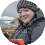 Cassandra in the Arctic holding a notepad