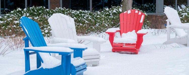 Chairs covered in snow
