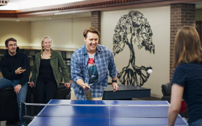 Students playing ping pong in University College.