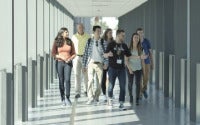 Students walking down a corridor