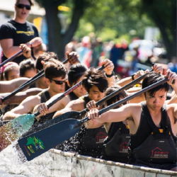 Students padding in a dragon boat