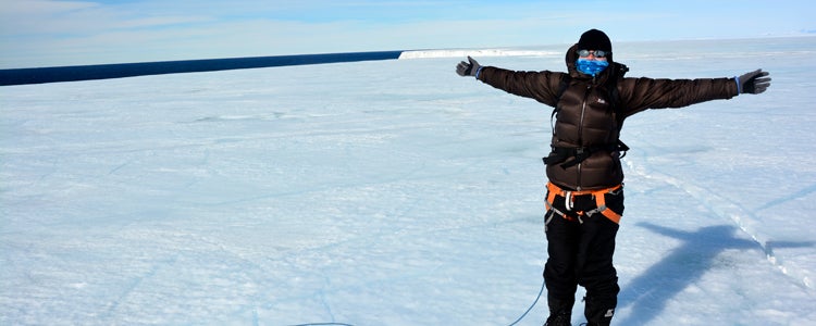 Waterloo Geography professor Christine Dow stands on a massive ice sheet in Antarctica while studying climate science