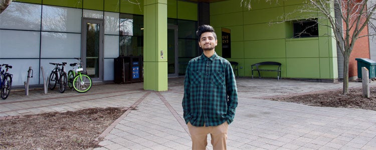 Hafeez, a Planning student at Waterloo, standing infront of the Environment 3 building on campus.