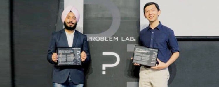 Harmohit (left) wins the Quantum Valley Investments ® Problem Pitch.