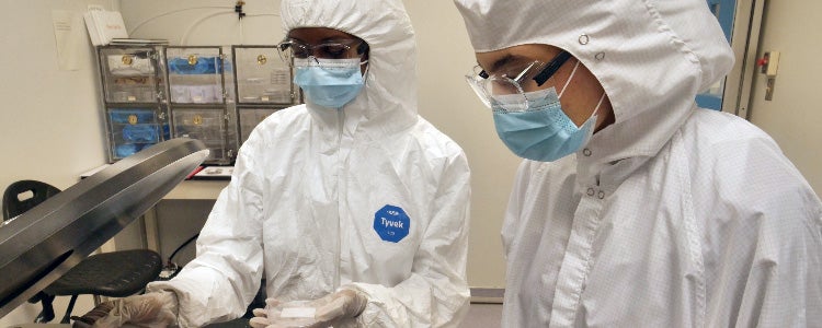 Students wear full-body clean suits in a Nanotechnology Engineering lab at the University of Waterloo.