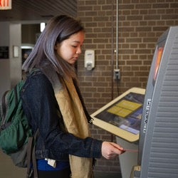 Student at an atm