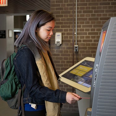 Student using an atm