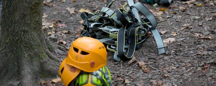 Helmets and safety harnesses used for the high ropes course.