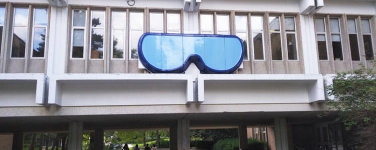 Large goggles hung from a building