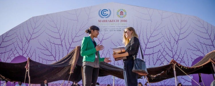 Baily and another University of Waterloo representative chat between sessions at COP 22