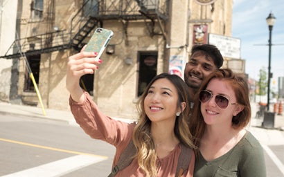 Three students taking a selfie.
