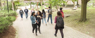 Group of Waterloo students walking on campus.