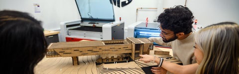 Architecture students working on a model project